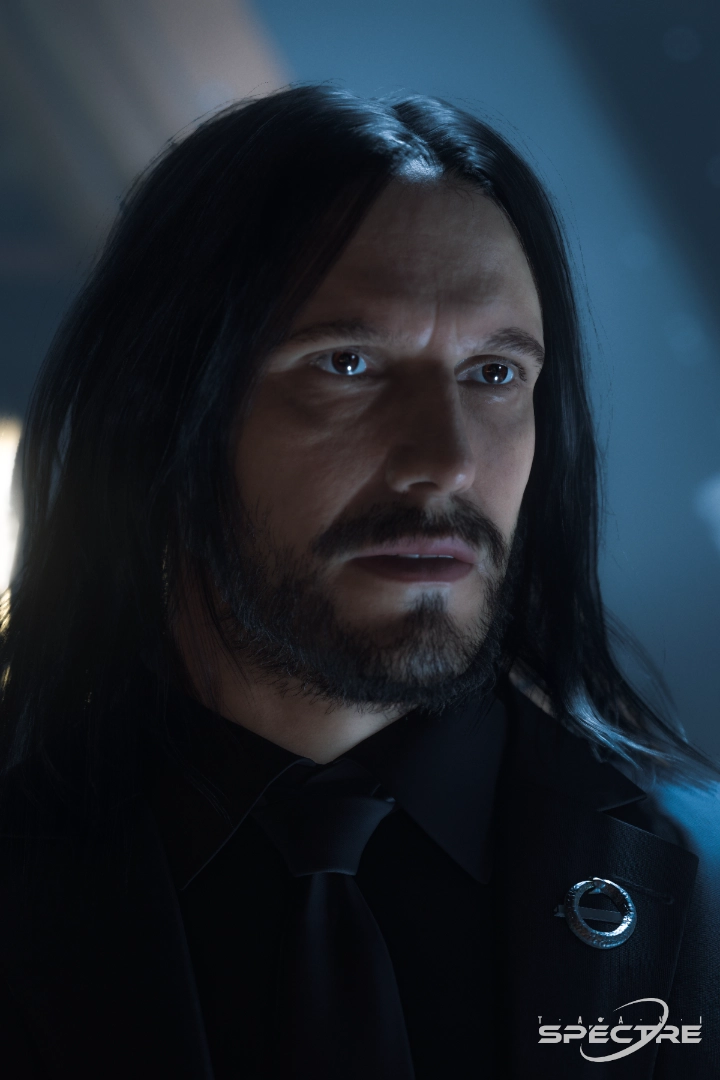 Aren Vale, an independent incident investigator, in dark functional clothing, standing in low industrial light.
